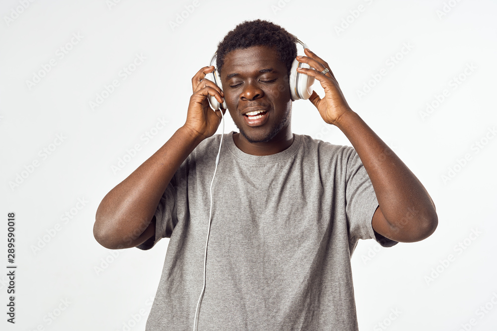 Fototapeta premium young man with headphones listening to music