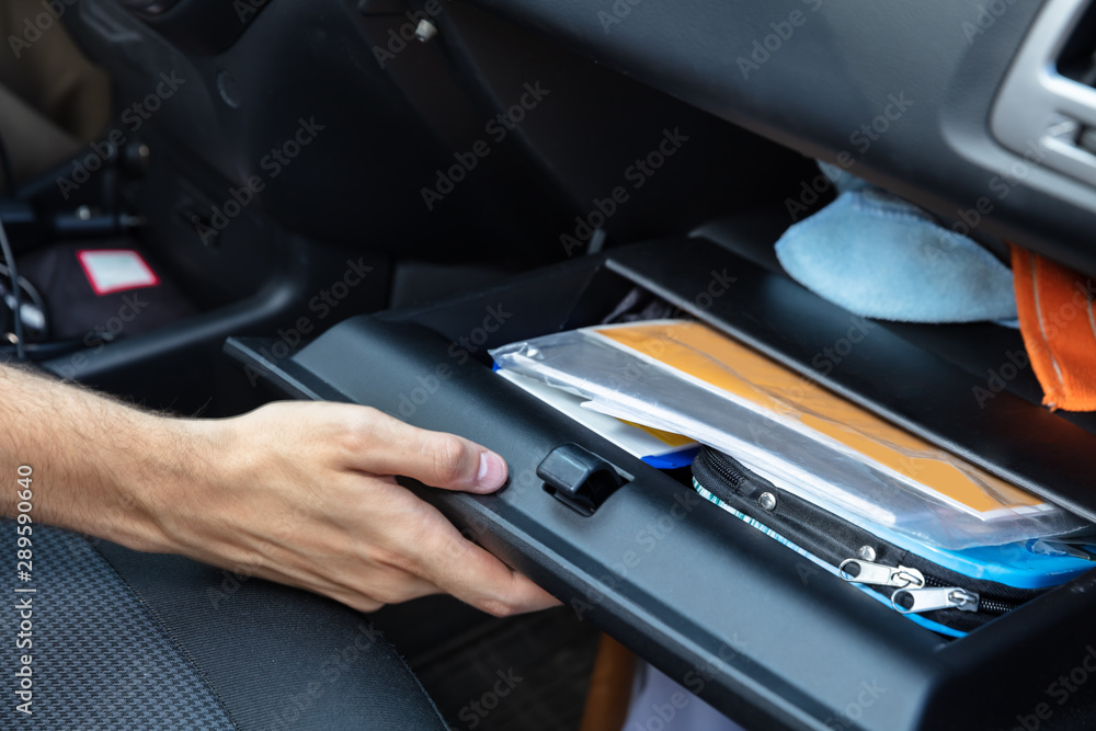 Driver Opening Glovebox Compartment - obrazy, fototapety, plakaty 