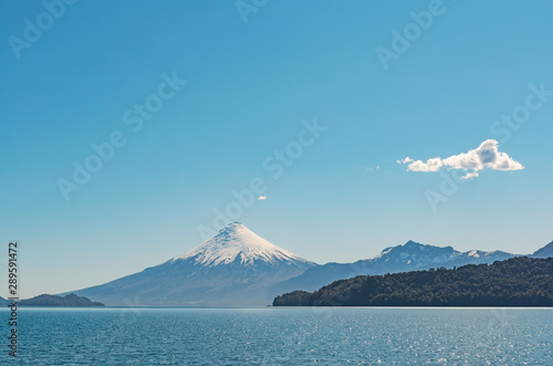 The majestic Osorno volcano by the Todos los Santos lake (All Saints Lake) in the chilean Lake District near the city of Puerto Varas and Puerto Montt, Chile.