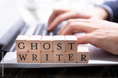 Ghostwriter Wooden Block On Computer Keyboard