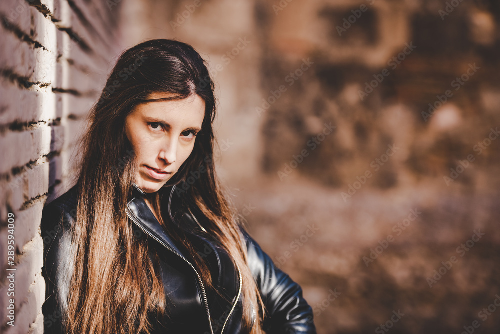 Fototapeta premium Portrait of young woman with worried expression, thoughtful about her future career.