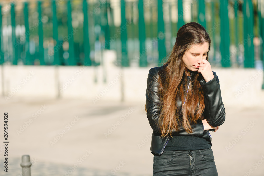 Sad girl feeling upset receiving bad news in mobile message on smartphone at street, depressed and sad young woman holds phone. Sad girl feeling upset receiving bad news in mobile message on smartphone at street, depressed and sad young woman holds phone.