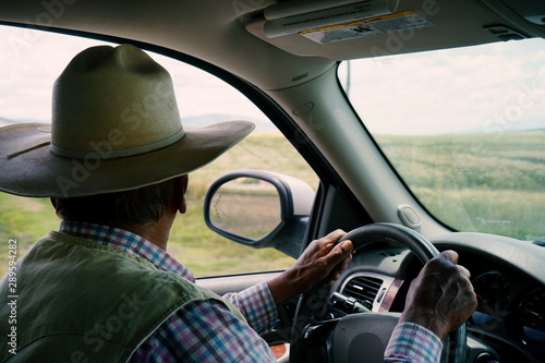 man looking out the window