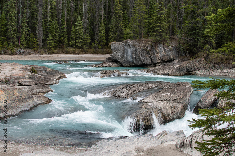 Fast flowing river running over the rocks Fast flowing river running over the rocks