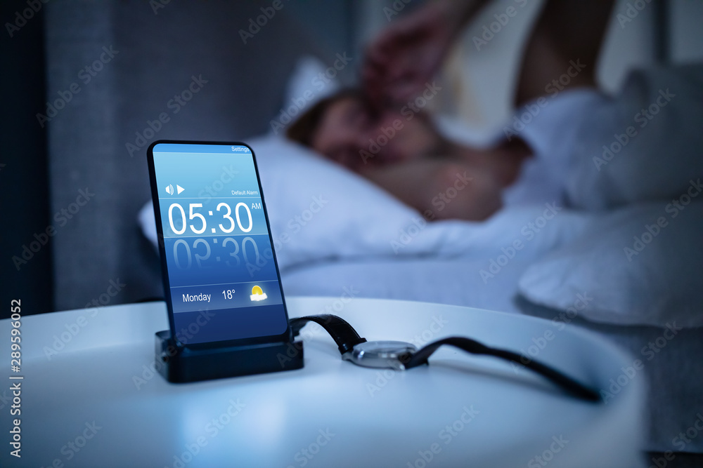 Man Waking Up With Alarm On Mobile Phone - obrazy, fototapety, plakaty 