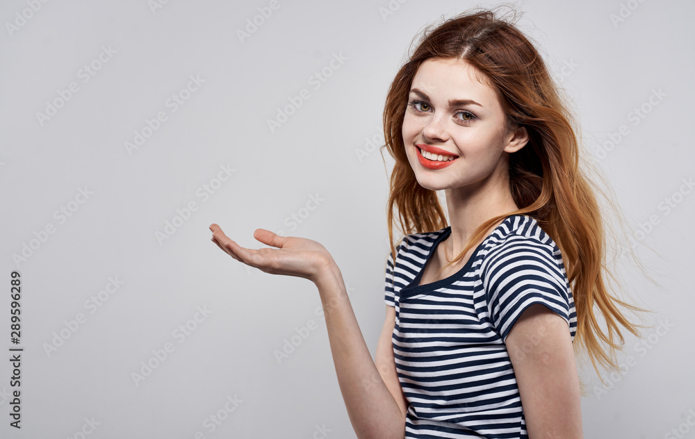 young woman pointing at copyspace young woman pointing at copyspace
