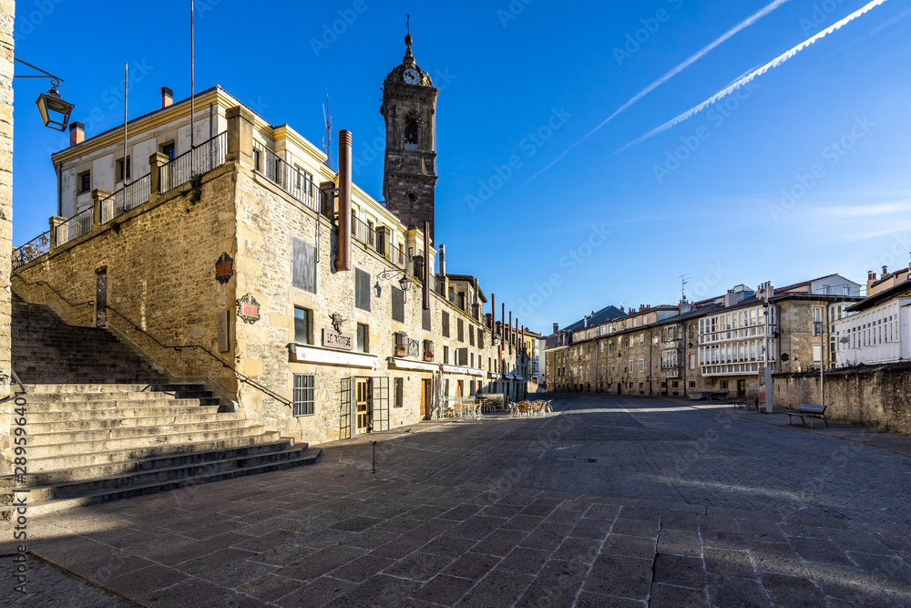 Bright blue sky over Vitoria-Gasteiz historic center, with the tower bell of Church of San Vicente Martir, Basque Country, Spain