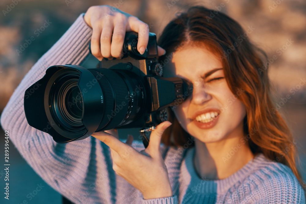 woman taking photo with digital camera woman taking photo with digital camera
