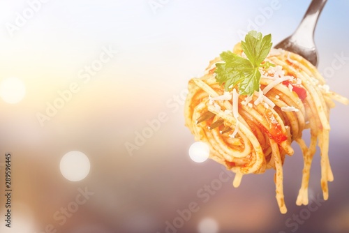 Fork with just spaghetti around it on backgrouund