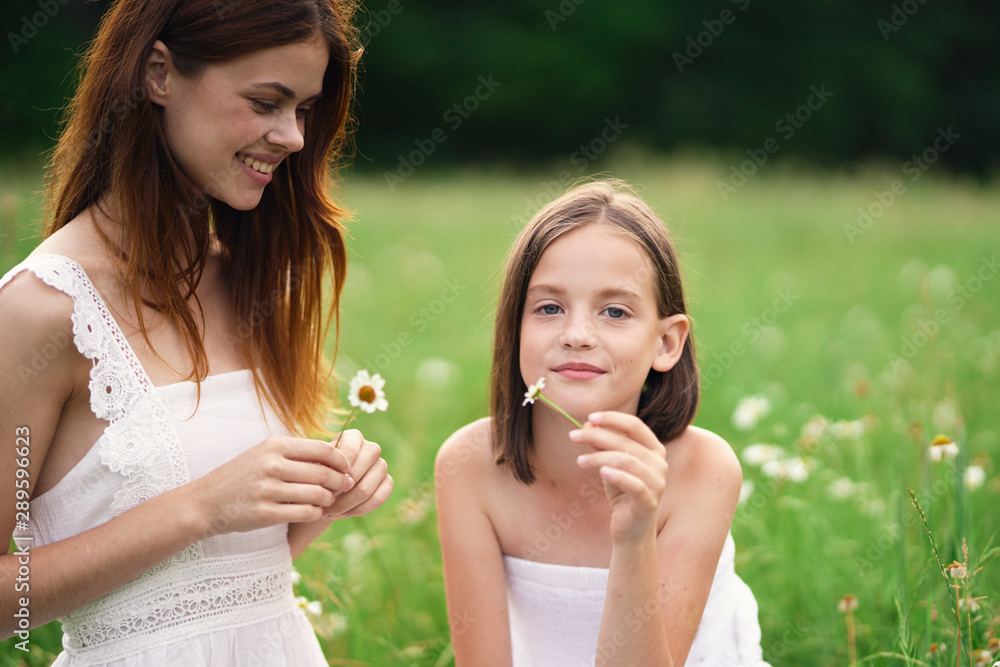 two girls eating ice cream in the park two girls eating ice cream in the park