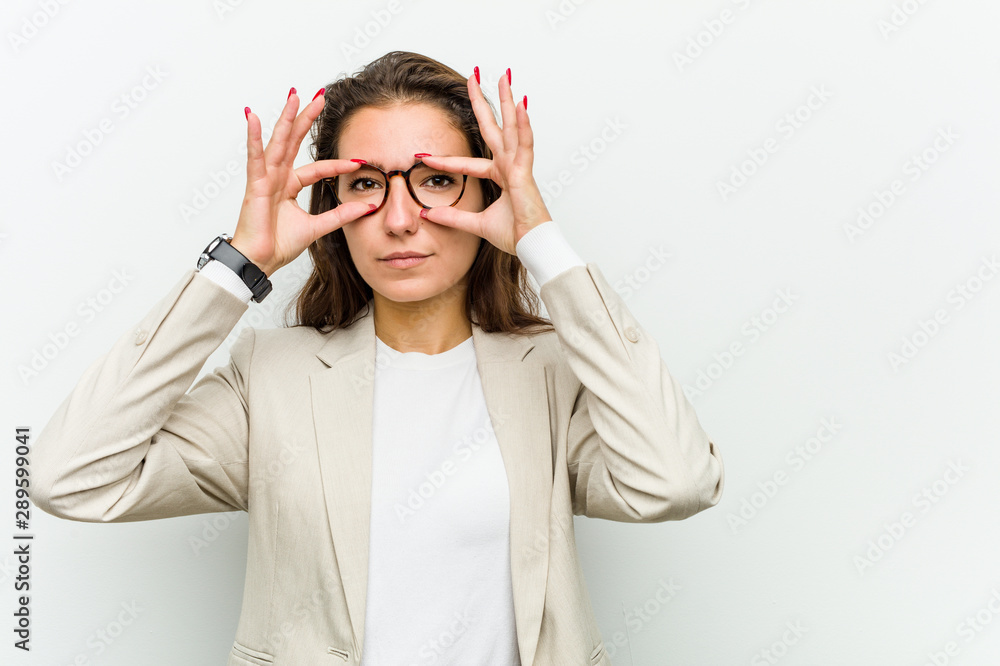 Young european business woman keeping eyes opened to find a success opportunity. Young european business woman keeping eyes opened to find a success opportunity.