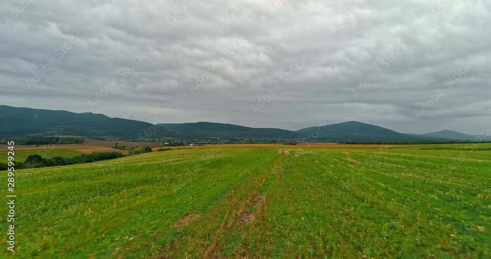 Drone view of the North Hungarian landscape of the Muzsla, part of Matra. Hills and fields of agricultural view with roads in the distance view. Cloudy view after rain with fog in the forest. Drone view of the North Hungarian landscape of the Muzsla, part of Matra. Hills and fields of agricultural view with roads in the distance view. Cloudy view after rain with fog in the forest.