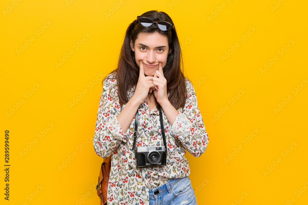 Young brunette traveler woman doubting between two options. Young brunette traveler woman doubting between two options.