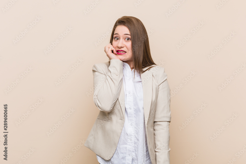 Young business woman biting fingernails, nervous and very anxious. Young business woman biting fingernails, nervous and very anxious.