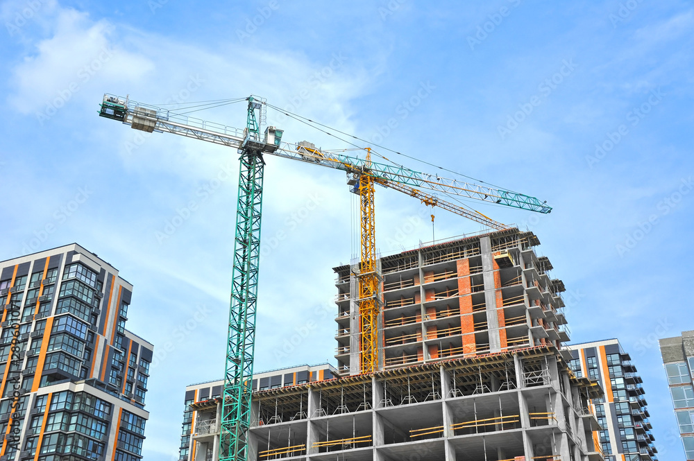 Crane and highrise construction site Crane and highrise construction site
