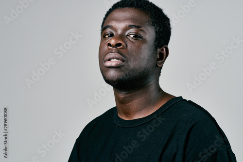 portrait of a young man isolated on black background