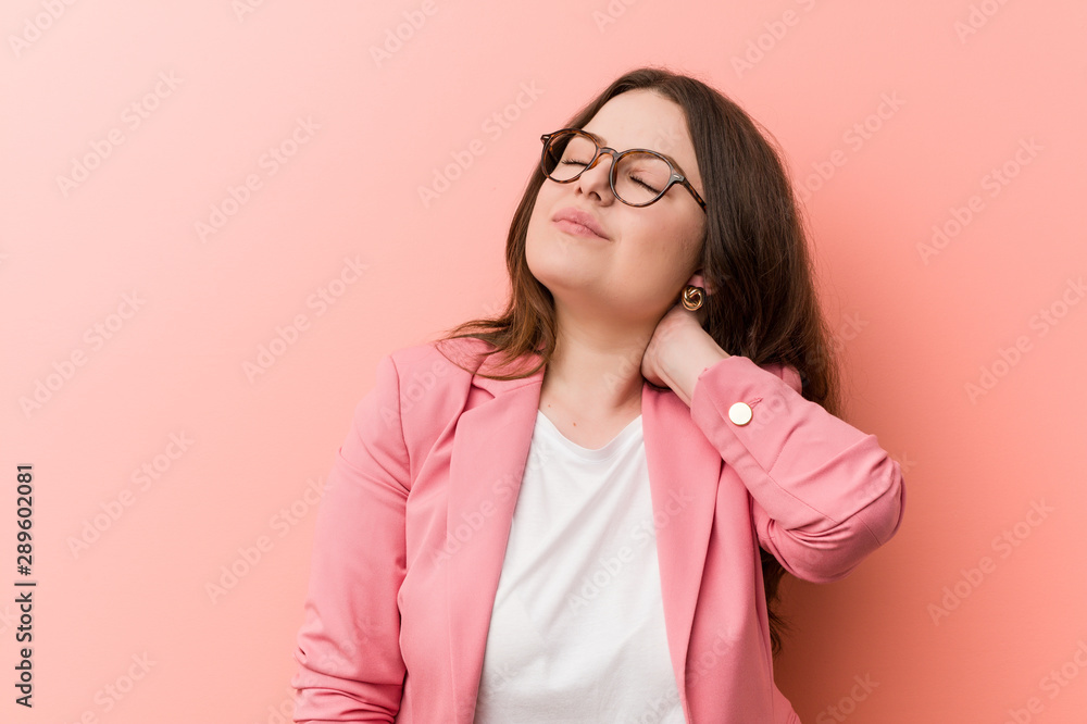Young plus size business caucasian woman suffering neck pain due to sedentary lifestyle. Young plus size business caucasian woman suffering neck pain due to sedentary lifestyle.