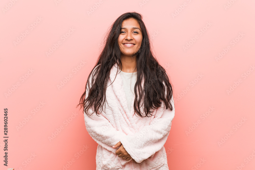 Young indian woman wearing pajama happy, smiling and cheerful. Young indian woman wearing pajama happy, smiling and cheerful.