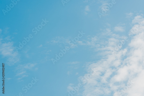 blue and clear sky with white clouds and copy space
