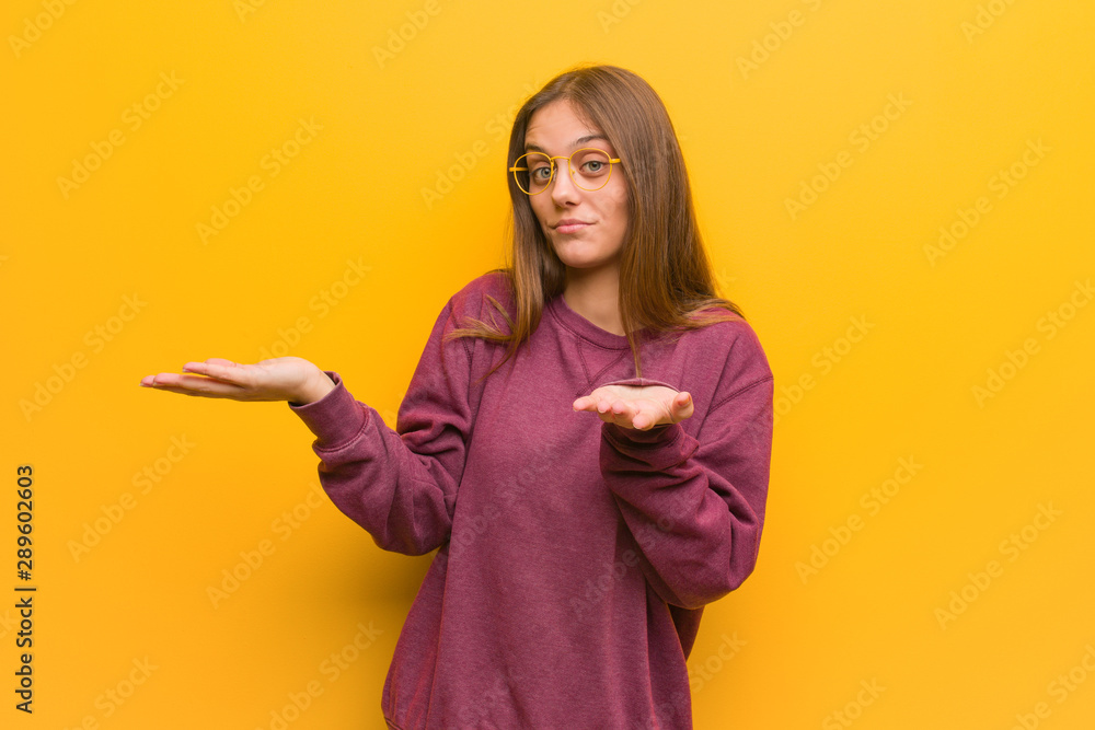 Young casual woman confused and doubtful Young casual woman confused and doubtful