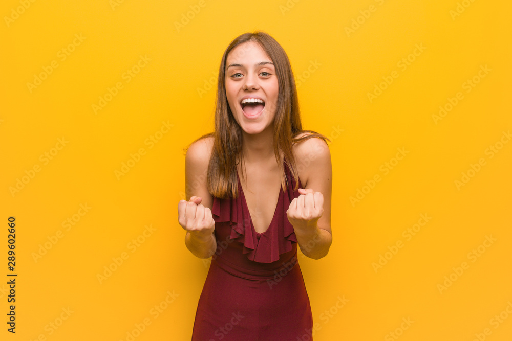 Young elegant woman wearing a dress surprised and shocked Young elegant woman wearing a dress surprised and shocked