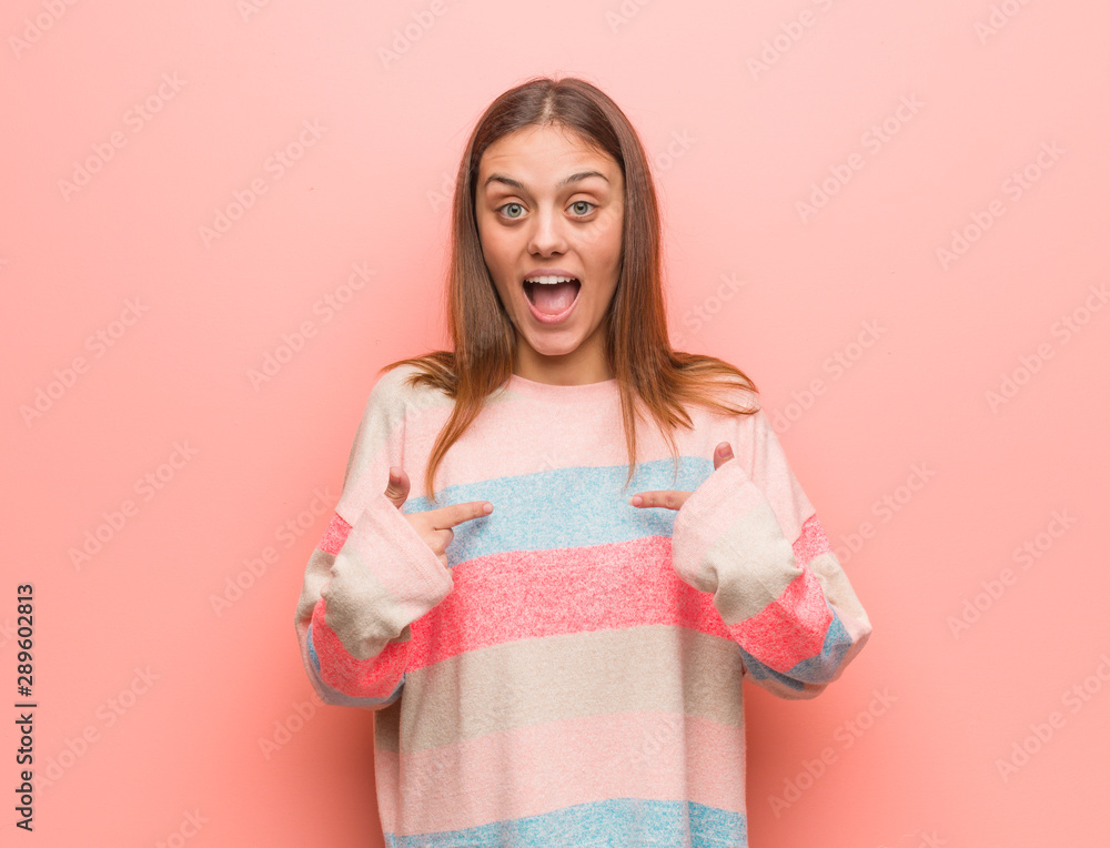 Young pretty caucasian woman surprised, feels successful and prosperous