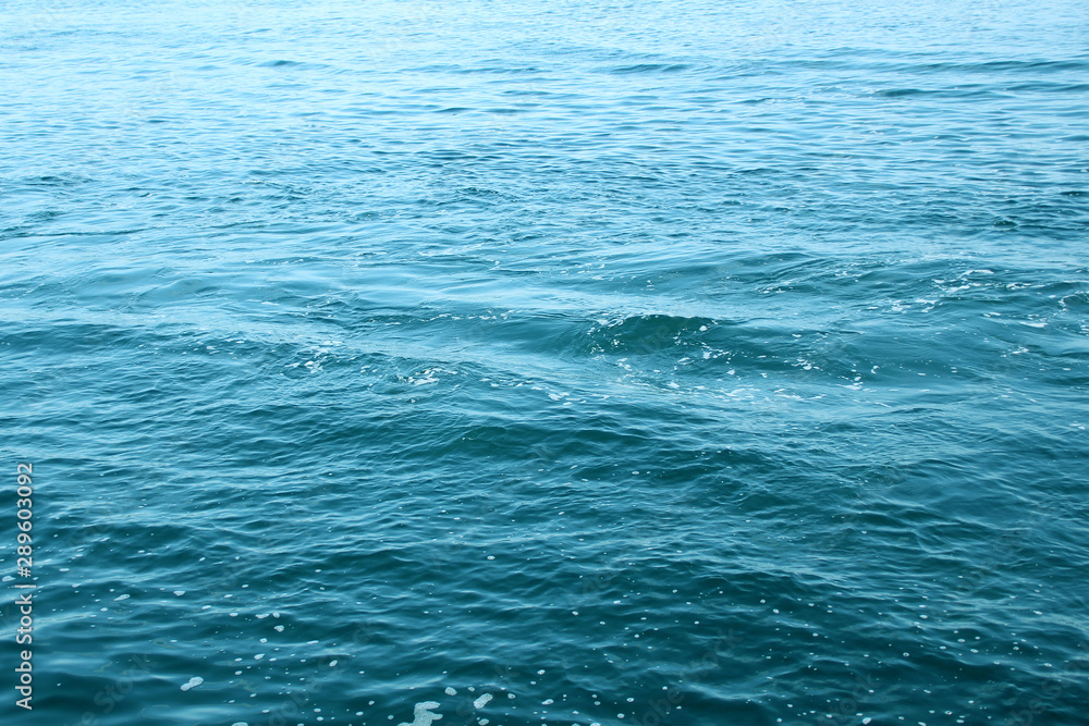 blue sea, ocean waves, water with foam and bubbles, texture, water natural resources concept, close-up, copy space blue sea, ocean waves, water with foam and bubbles, texture, water natural resources concept, close-up, copy space