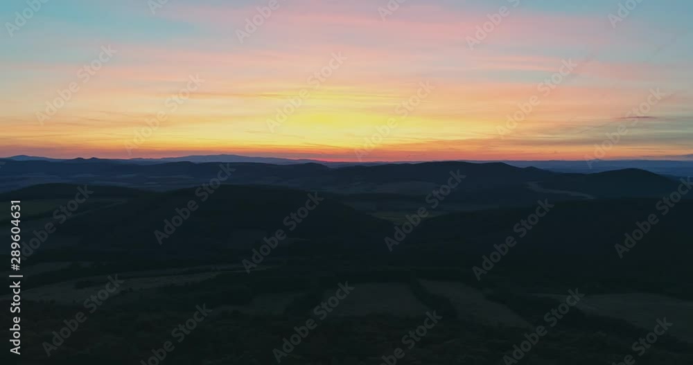 Drone view of the North Hungarian landscape of the Muzsla, part of Matra. Hills and fields of agricultural view with roads in the distance view. Hungarian town Paszto. View from the peak named Tepke. Drone view of the North Hungarian landscape of the Muzsla, part of Matra. Hills and fields of agricultural view with roads in the distance view. Hungarian town Paszto. View from the peak named Tepke.