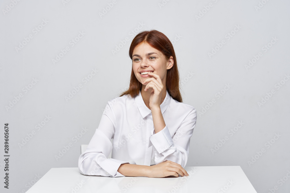 young businesswoman sitting at desk young businesswoman sitting at desk