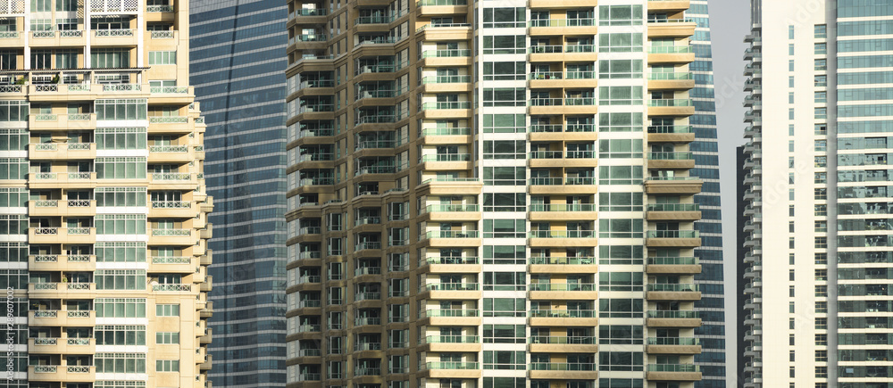 Close-up view of some modern buildings and skyscrapers in Dubai. Dubai is the largest city in the United Arab Emirates (UAE) and the capital of the Emirate of Dubai. Close-up view of some modern buildings and skyscrapers in Dubai. Dubai is the largest city in the United Arab Emirates (UAE) and the capital of the Emirate of Dubai.