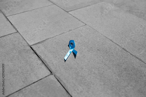 blue ribbon on gray stone, prostate cancer photo