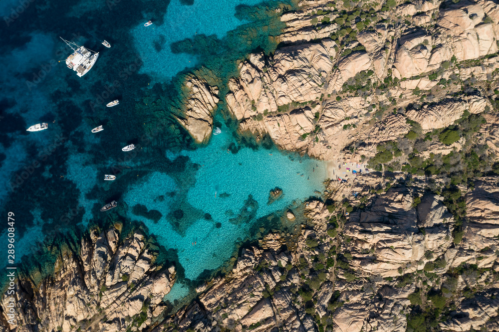 View from above, Stunning aerial view of Cala Coticcio also known as Tahiti with its rocky coasts and small beaches bathed by a turquoise clear water. La Maddalena Archipelago, Sardinia, Italy.