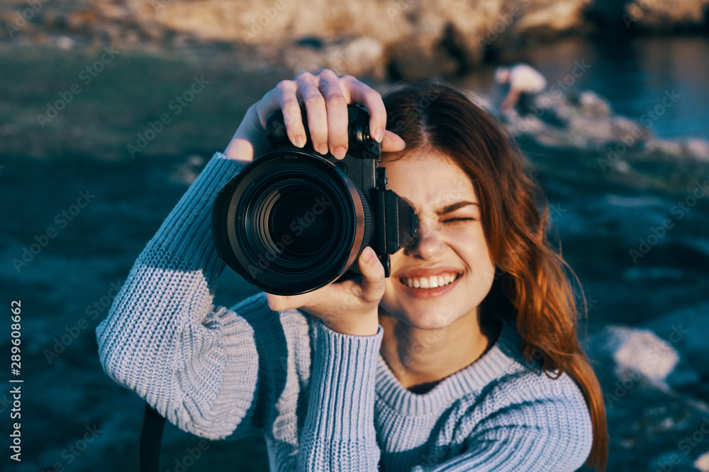 woman taking photo with digital camera woman taking photo with digital camera