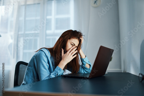 businesswoman talking on the phone in her office