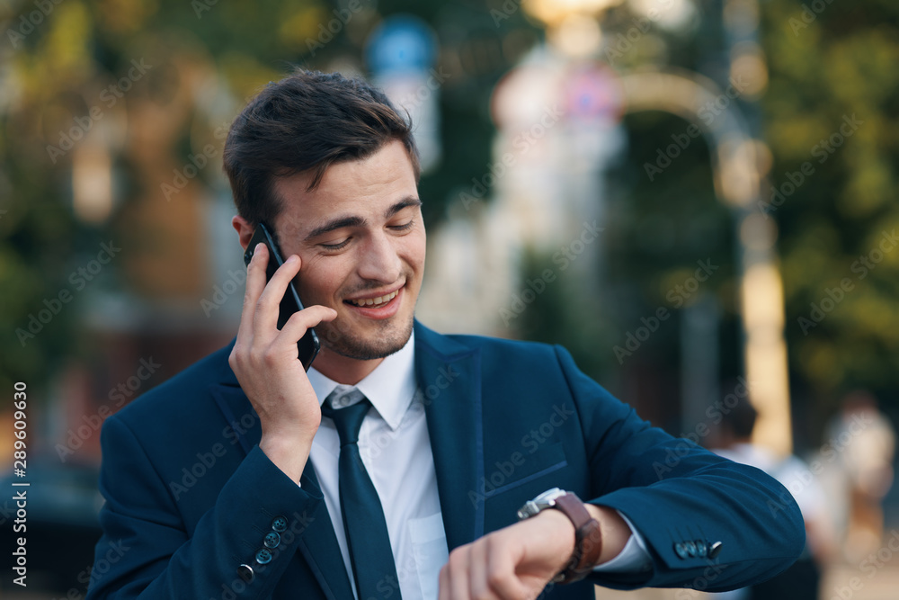 young businessman talking on cell phone young businessman talking on cell phone