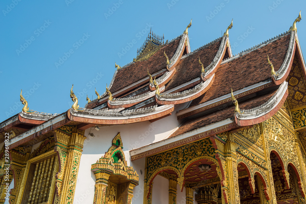 Beautiful exterior of an iconic Buddhist temple in the royal palace of Luang Prabang, the UNESCO world heritage site in north central of Laos. Beautiful exterior of an iconic Buddhist temple in the royal palace of Luang Prabang, the UNESCO world heritage site in north central of Laos.
