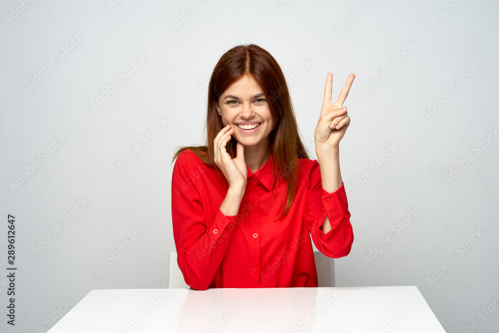 portrait of young woman pointing at copyspace portrait of young woman pointing at copyspace