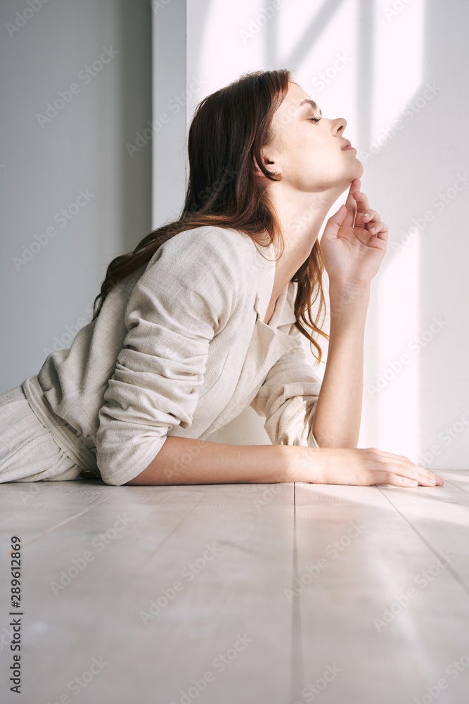 portrait of a woman sitting on sofa portrait of a woman sitting on sofa