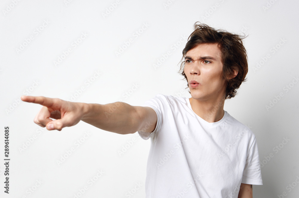 young man pointing at something young man pointing at something