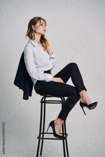 businesswoman sitting on office chair isolated on white © SHOTPRIME STUDIO