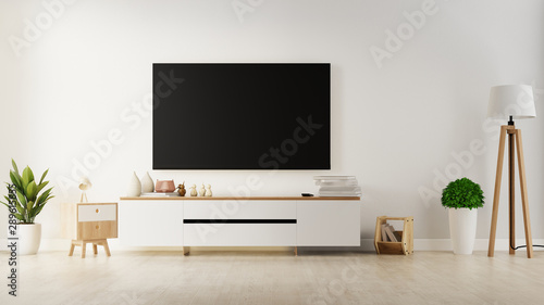 TV on the cabinet in modern living room with plant on white wall background,3d rendering © pramote