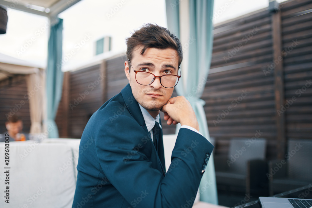 Fototapeta premium young businessman talking on mobile phone
