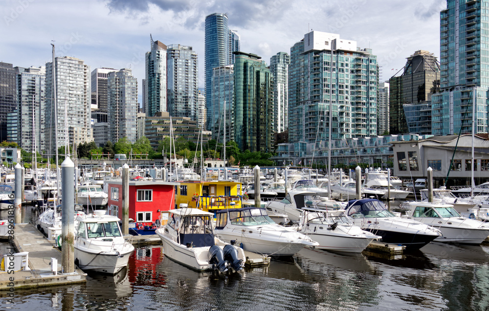 Beautiful cityscape of Vancouver and bright floating houses in marina, British Columbia Canada