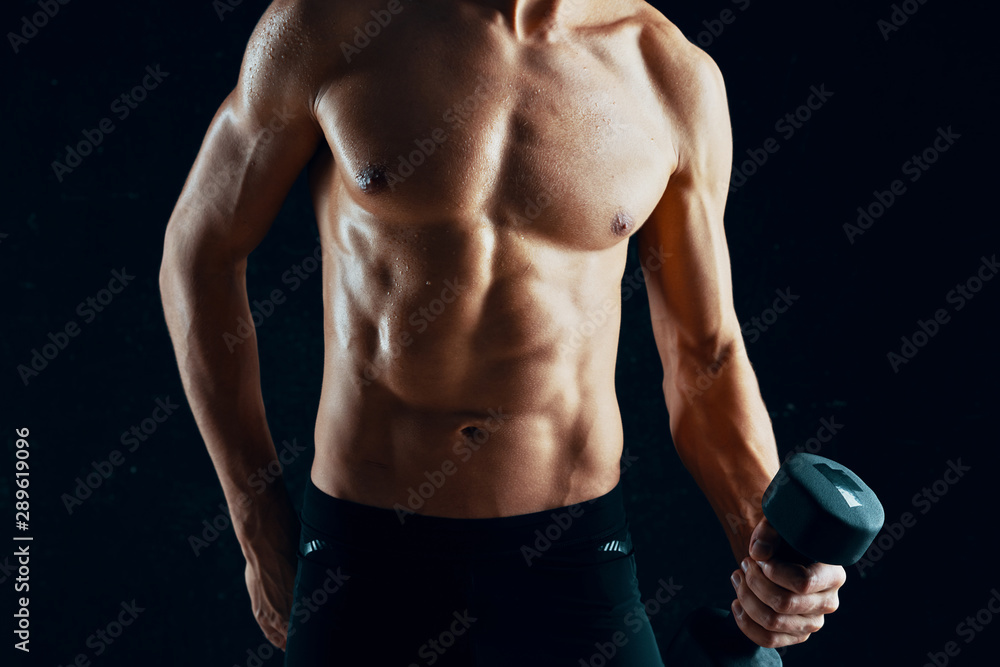 muscular man with dumbbells