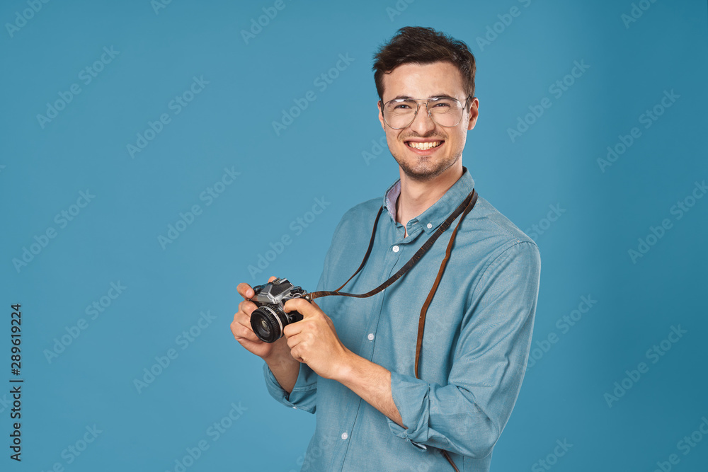 young man with a camera young man with a camera