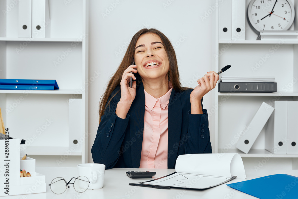 businesswoman talking on phone in office businesswoman talking on phone in office