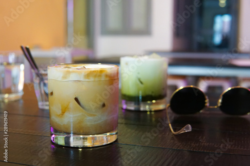 Coffee and green tea at a café in Singapore.