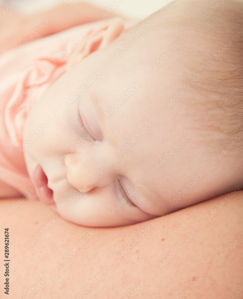 baby asleep on mothers chest, loving skin to skin baby asleep on mothers chest, loving skin to skin