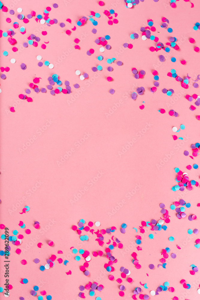 Festive party holiday colorful confetti on pink pastel background with copy space. Festive party holiday colorful confetti on pink pastel background with copy space.