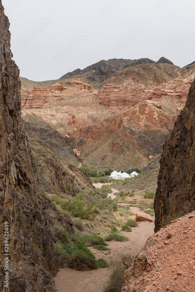 Camping from yurts. Charyn canyon, Charyn river valley. Red rocks and vertical canyon. Almaty region, Kazakhstan.